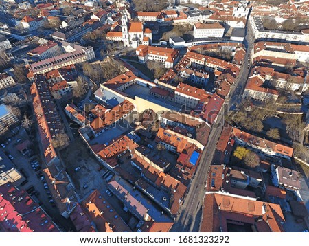 Red roofs of Vilnius city downtown building. Drone footage. 