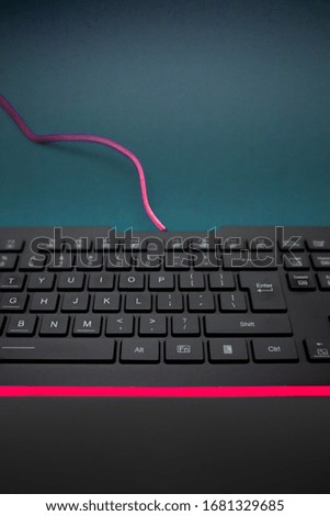 Close-up photo of black keyboard on the table. Office, working from home concept