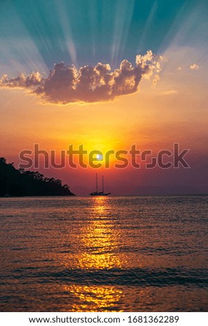colorful ocean sea sunset view. tourists swimming and boats sailing
