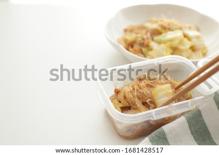 Chinese simmered glass noodles and dried shrimp in food container for stock 