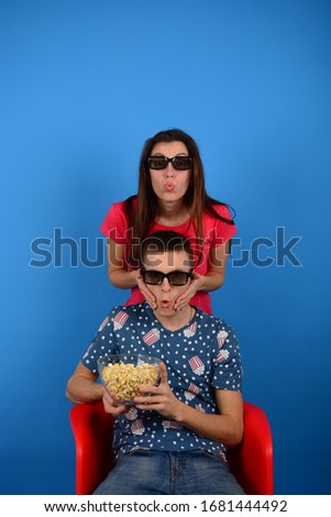 young woman and man watching movie isolated background 3d cinema