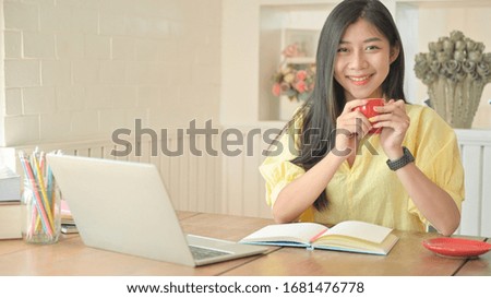 Asian woman with a laptop working at home. To prevent the spread of the coronavirus.