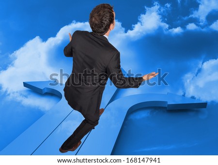 Businessman posing with arms out against arrows in the sky in blue