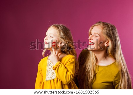 Mother and daughter in studio, happy moments