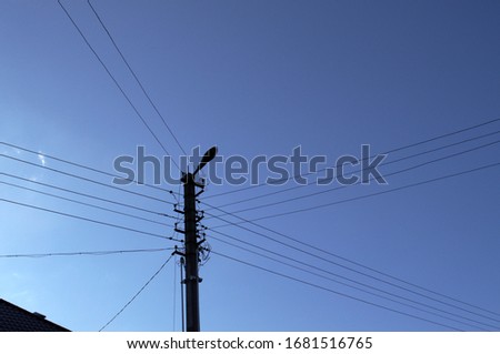 Electrical wires on background blue clear sky