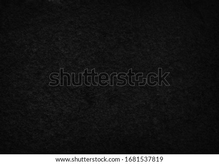 Abstract black grunge stone wall texture background.