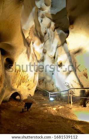 Prehistorical cave with pictures in the walls