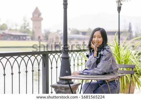 Beautiful asian girl enjoying on holiday with vintage tone