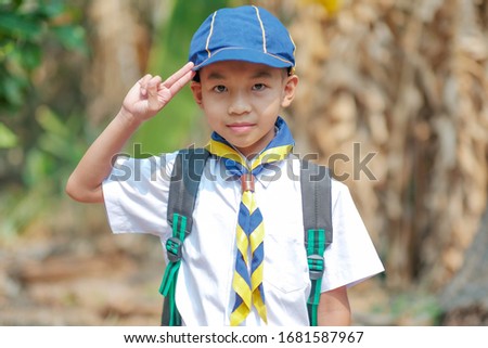 A boy scout ready to camping.