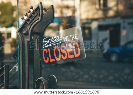 Close-up sign - sorry we are closed on the door at the entrance to the store or cafe.