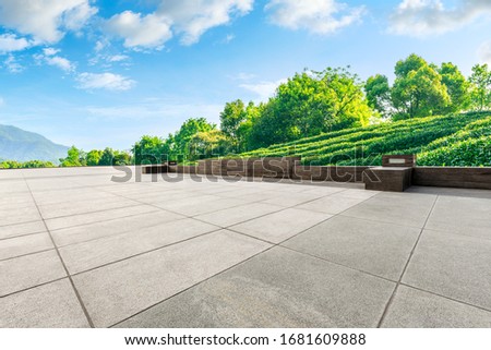 Empty square floor and green tea mountain nature landscape on sunny day.