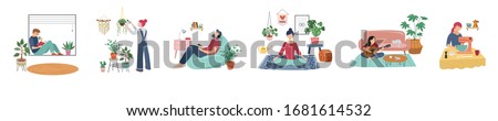 Quarantine, stay at home concept series - people sitting at their home, room or apartment, practicing yoga, enjoying meditation, relaxing on sofa, reading books, baking and listening to the music.  Royalty-Free Stock Photo #1681614532