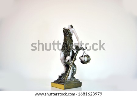 
broken themis statue represents injustice