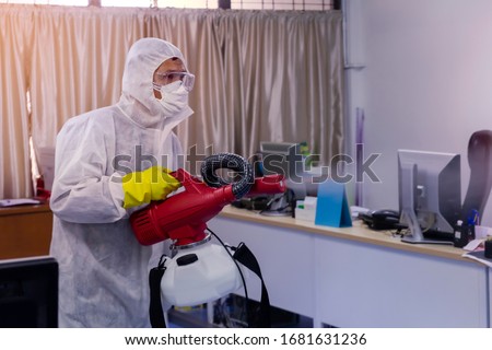 Disinfecting spray anti Corona virus in business office as a prevention against Coronavirus disease 2019,COVID-19 Royalty-Free Stock Photo #1681631236