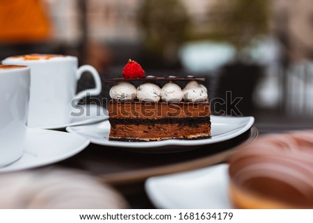 Chocolate cake with strawberry in dish. Dessert concept.