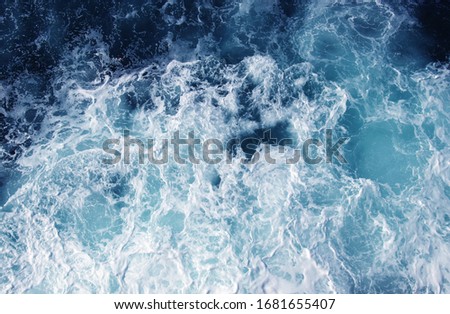 Abstract blue sea water with white wave for background