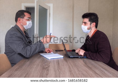 Men working in the office wear masks to protect against covid-19. coronavirus Royalty-Free Stock Photo #1681658182