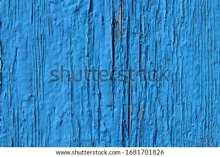 Old wooden painted board in blue. Close-up. Vertical view. Background. Texture.