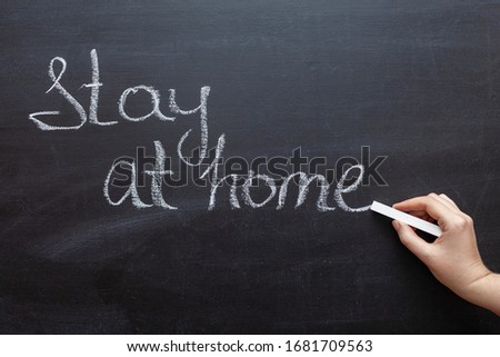 Coronavirus pandemic behaviour rules or health advice - stay at home. Stay at Home. Stay at Home chalkboard inscription