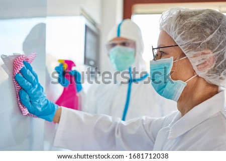Disinfection and cleaning in the intensive care unit of a clinic with infectious Covid-19 patients Royalty-Free Stock Photo #1681712038