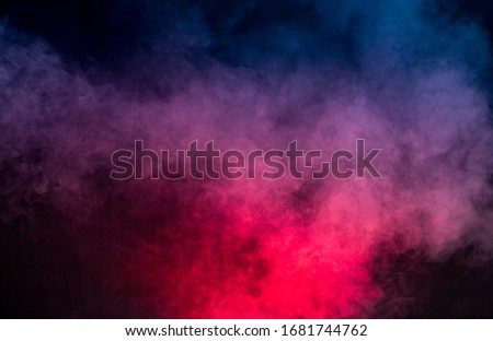 colorful smoke on dark background Royalty-Free Stock Photo #1681744762