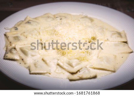 La buona pasta. Ravioli stuffed with ricotta cheese and spinach dipped in a four cheese sauce.