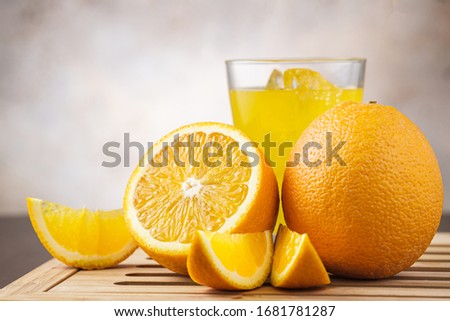 Close-up orange fruit cut and with slices. Vegetarian and organic food and drink