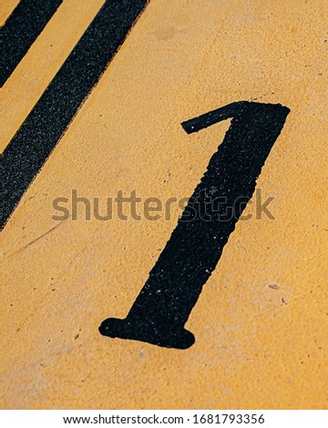 platform 1, marked on the floor of a speed bump at the train station