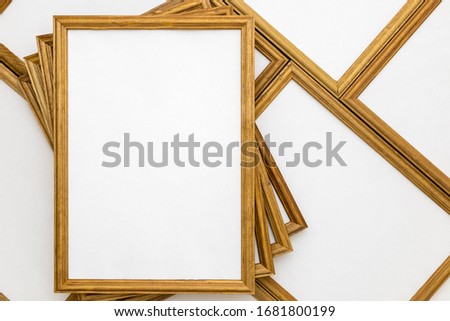 square wooden frames with a white text field on a background from other frames
