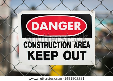 Danger Construction area Keep out Sign on chain link fence