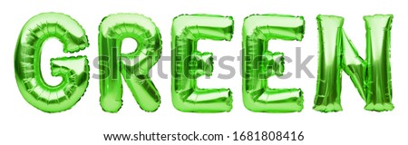 Word GREEN made of green inflatable balloons isolated on white background. Helium foil balloons forming phrase. Celebrating decoration, ecology, no waste, go green concept