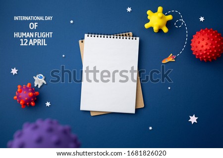 concept of СONQUEST
OF SPACE Astronaut explores space on blue isolated background. International day of human space flight. 12 April World Cosmonautics Day.