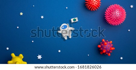 concept of СONQUEST
OF SPACE Astronaut explores space on blue isolated background. International day of human space flight. 12 April World Cosmonautics Day.