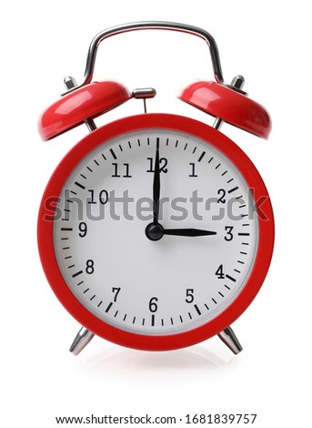 Red alarm clock set at three isolated over white background close-up with clipping path
