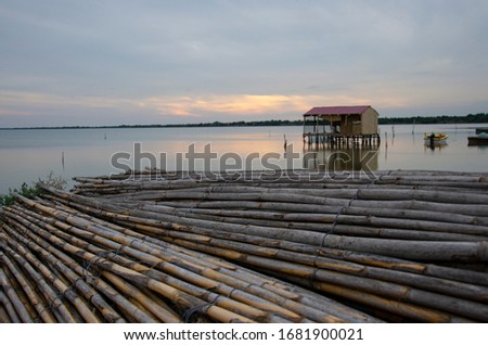 A fishermen hut in the water, sea, river in sunset
