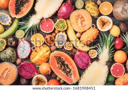 Exotic fruits - pineapple, papaya, mango, annona, banana, pitahaya, kiwano, african horned melon, tamarillo fruit, granadilla, salak, snake fruit, maracuya, rambutan, lychee, longan, tamarind Royalty-Free Stock Photo #1681908451