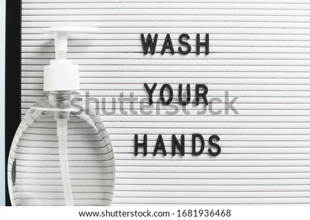 Hand Sanitizer, antibacterial soap and Wash Your Hands sign in English. Personal hygiene and disinfection against virus and warding germs during viral pandemic and flu season poster or banner