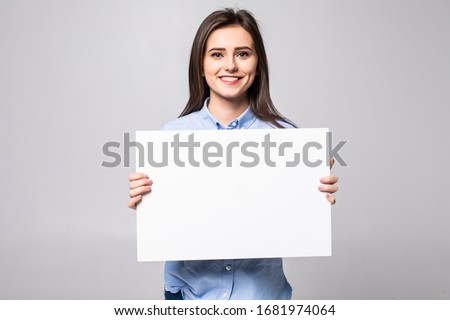 Beautiful woman holding a blank billboard isolated on white background Royalty-Free Stock Photo #1681974064