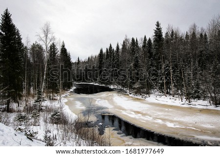 Frozen Tohmajoki River view in Karelia by winter, Russia