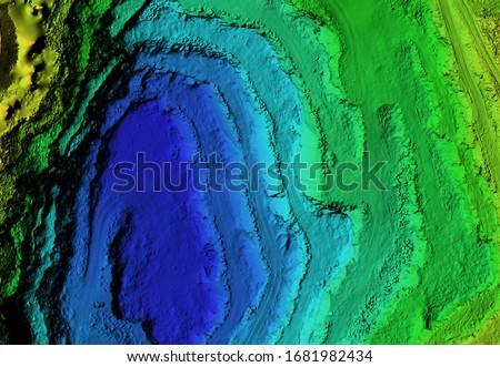 DEM - digital elevation model. GIS product made after processing aerial pictures taken from a drone. It shows excavation site with steep rock walls Royalty-Free Stock Photo #1681982434