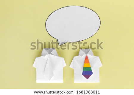Talk about LGBT people, discussion. Dialog box, thoughts. Shirts made of paper with colour flag. Orientation, opportunity choice. Rights of homosexual. Place for text, copy space.