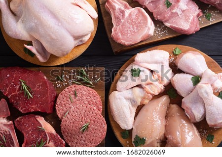 Assortment of meat and seafood . Beef , chicken , fish and pork Royalty-Free Stock Photo #1682026069