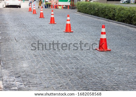 Traffic cones placed on the road surface To divide the lane into two lanes for safety