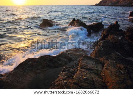 Rock and stone on the sunset at Khao Leam Ya ,Rayong Thailand,Amazing beach sunset. Long Exposure.