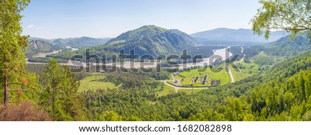 Panoramic view of the Katun river valley, Altai. Sunny day in early summer. Travel and vacation in the mountains.