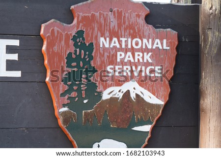 National Park Service Insignia And Emblem At Yellowstone National Park, Wyoming.