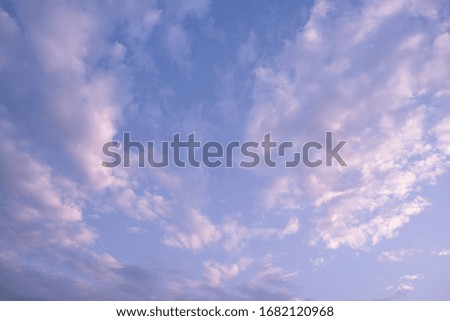 purple and blue sky with rosy clouds before sunset