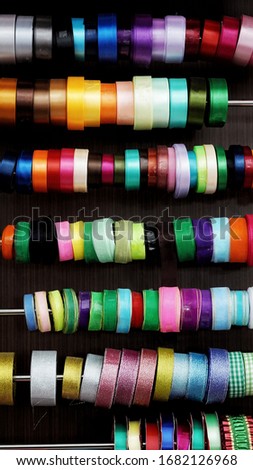 multicolored ribbons on display, ready to use for straps and gift decorations