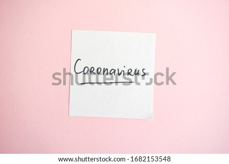 COVID-19 virus concept with pills and other safe staff  on pastel pink background with copy space