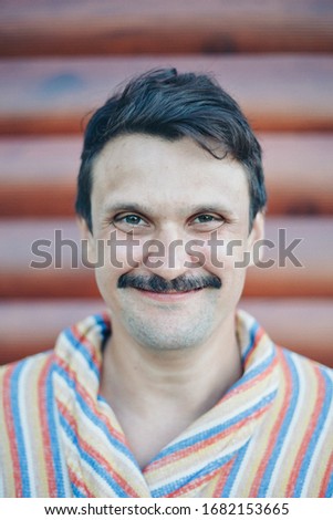 portrait of a man with a mustache. Face close -up. The concept of shaving , style, fashion, moustache formation